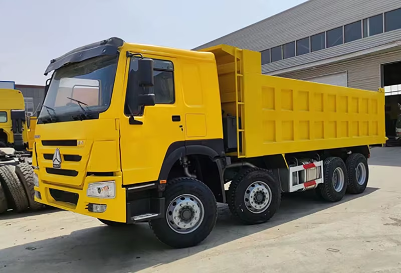 Used Howo Dump Truck 371hp 8x4 Left Hand Drive Diesel WP Engine AC 12 Wheels for Zimbabwe